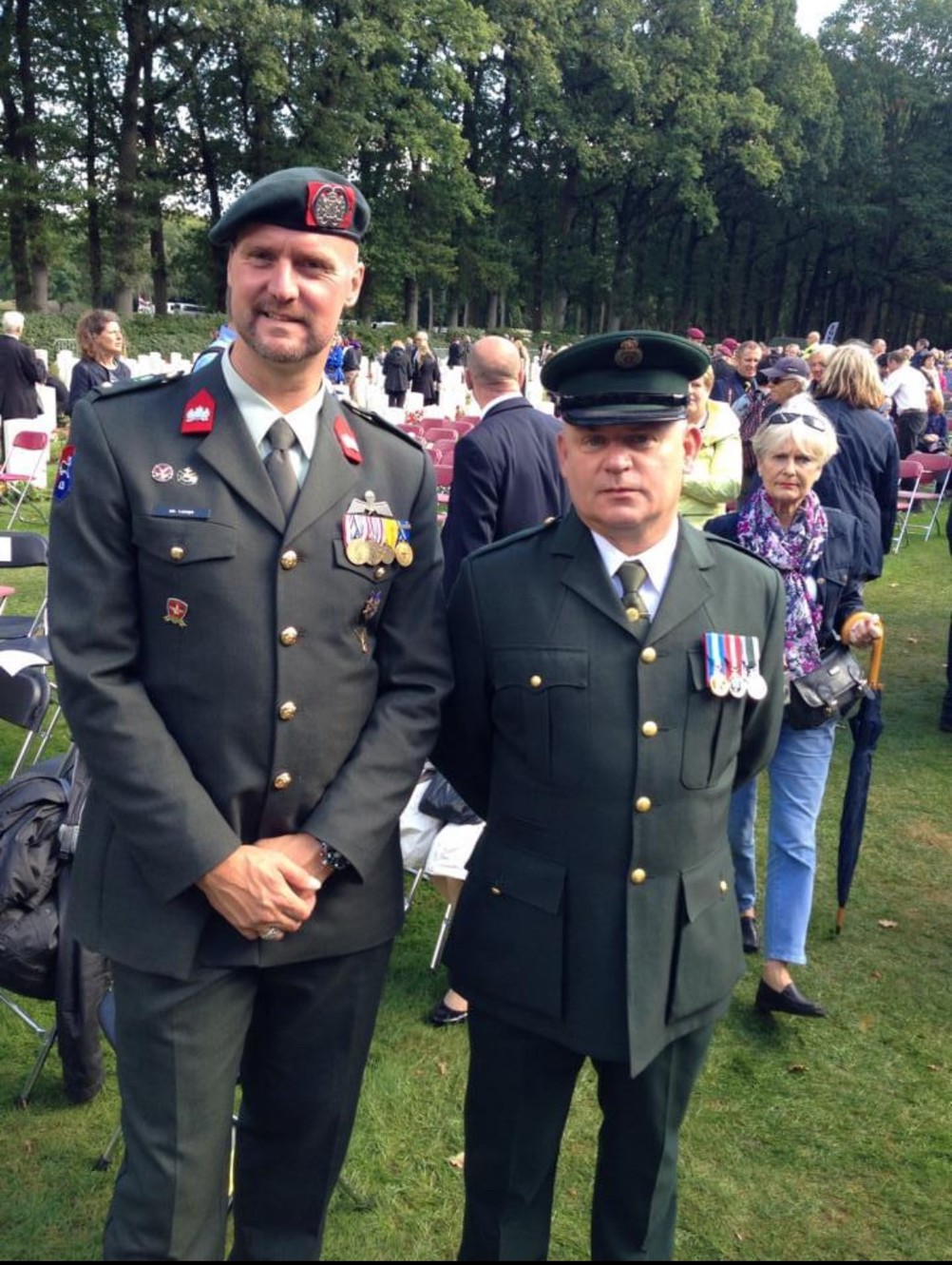 Kev Barnes and his friend Joop, a Dutch Commando, pose in Arnhem Oosterbeek War Cemetery.