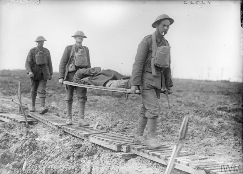 First World War stretcher bearers carrying a wounded man over No Man's Land.