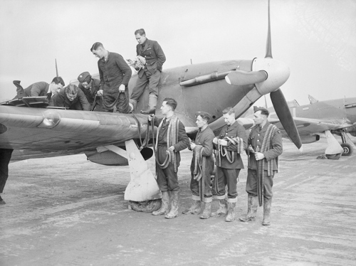 RAF Hurricane fighter plane being rearmed by ground crew