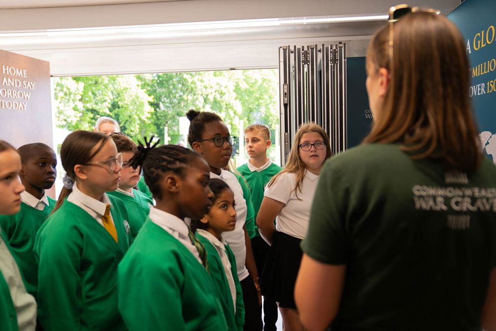 CWGC public engagement coordinator engages with schoolchildren at an event.