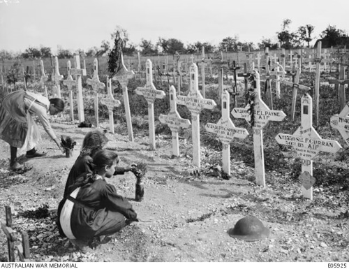 French children visiting Australian graves in the Harbonnieres area, France