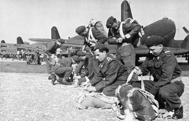 Polish paratroopers checking their equipment in front of a line of C-47 Aircraft prior to  heading for Arnhem.