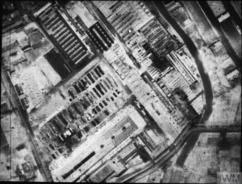 A black and white aerial photograph of the damaged MAN diesel factory in Augsburg.