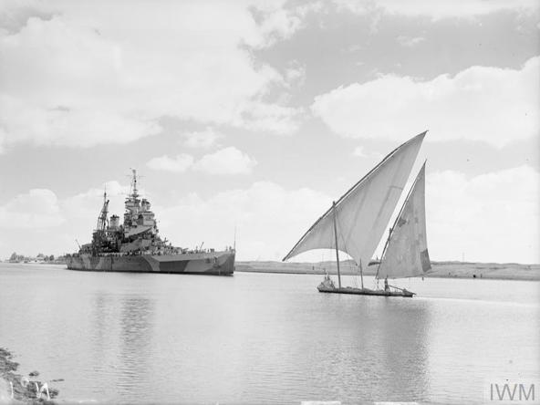 HMS HOWE closing an Egyptian felucca during passage of the Suez canal. © IWM (A 24896)