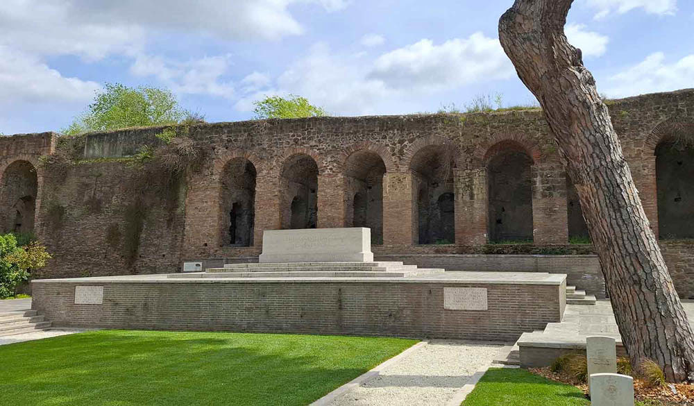 Stone of Remembrance at Rome War Cemetery. The Stone sits atop a raised platform in front of the Aurrellian Walls at the rear of the cemetery.