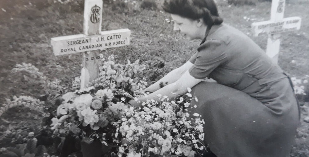 Nora Greaves attending to a war grave