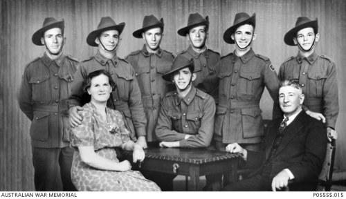A composite photo showing all seven Hutchins boys in the WW2-era Australian Infantry Uniform posing with their parents.