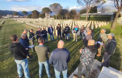 Gardeners stand in a circle at Cassino