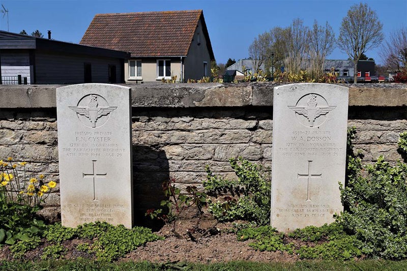 Two CWGC headstones of airborne paratroopers in Ranville War Cemetery