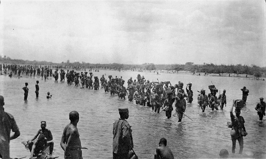IWM Q67823 Ammunition column of King's African Rifles crossing the Lurio River, Mozambique.