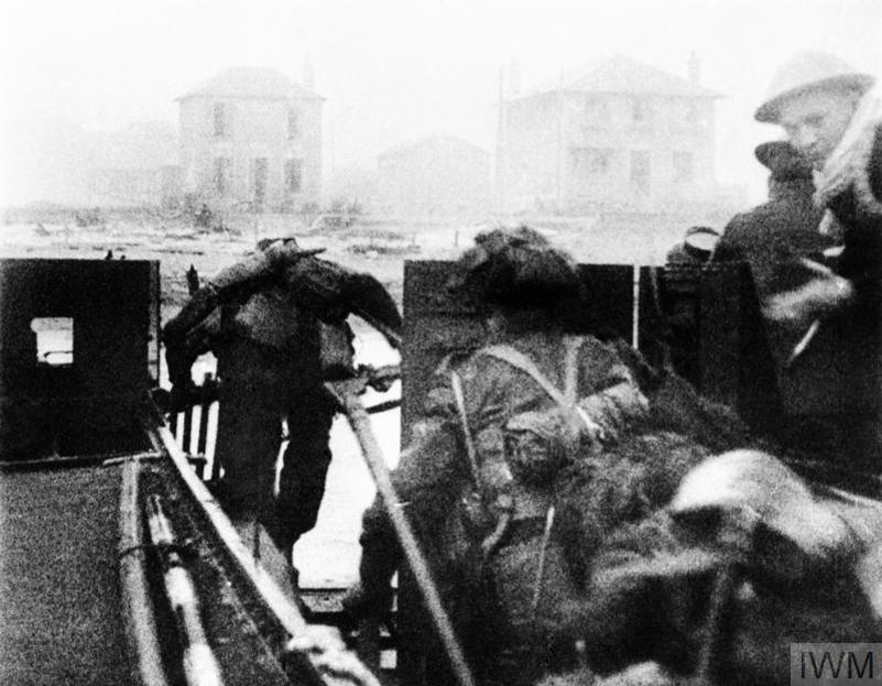 Canadian soldiers leaving their landing craft on D-Day.