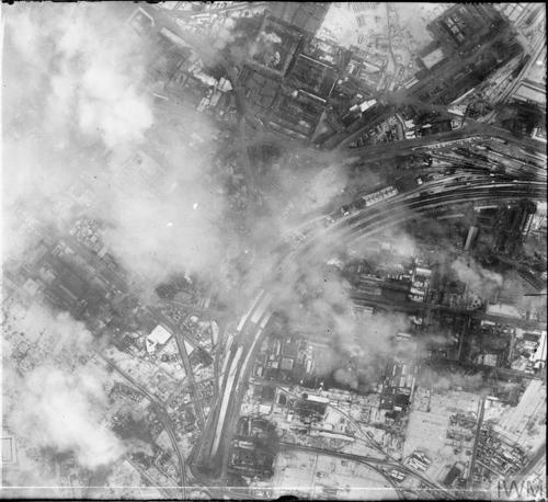 A black and white aerial photo of Stuttgart smoking after an RAF bombing raid.