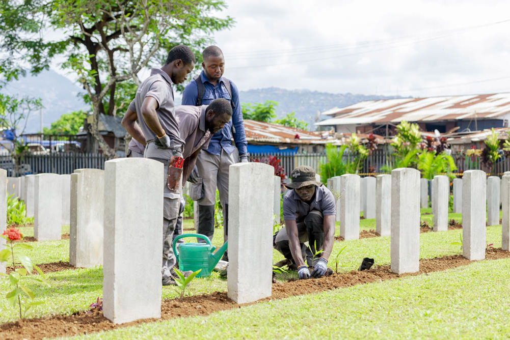 CWGC gardeners working on plant boarders at King Tom Cemetery, Freetown.