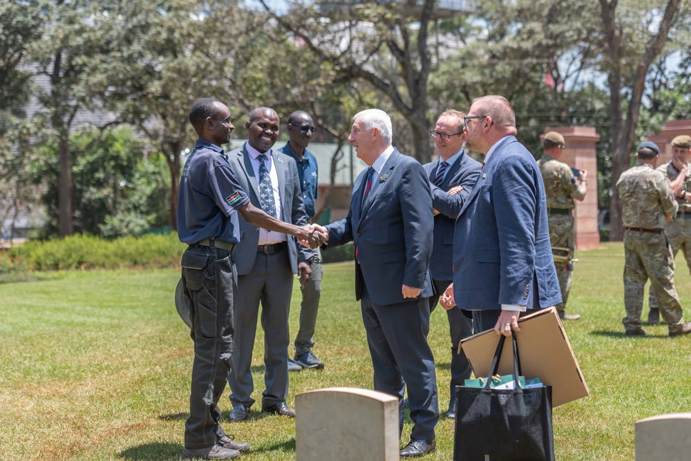 Lindey Hoyle greets CWGC staff in a Kenyan war cemetery.