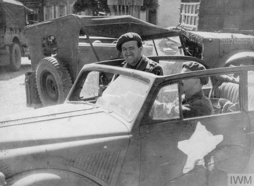 David Niven, then a Lieutenant-Colonel, sits in a Jeep in Paris circa 1944.