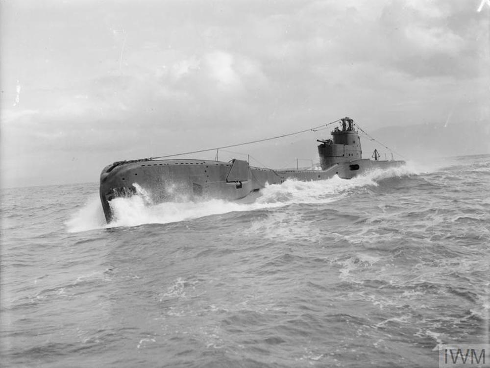 HMS Taka breaking waves of the Mediterranean sea as she sales on the surface.