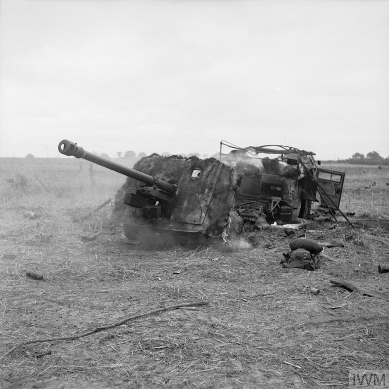 A destroyed 17 pounder anti-tank gun lies on the roadside in Normandy during Operation Epsom.
