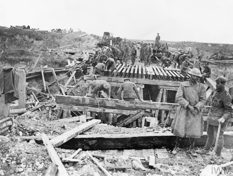 Royal Engineers construct a bridge over a canal during WW1.