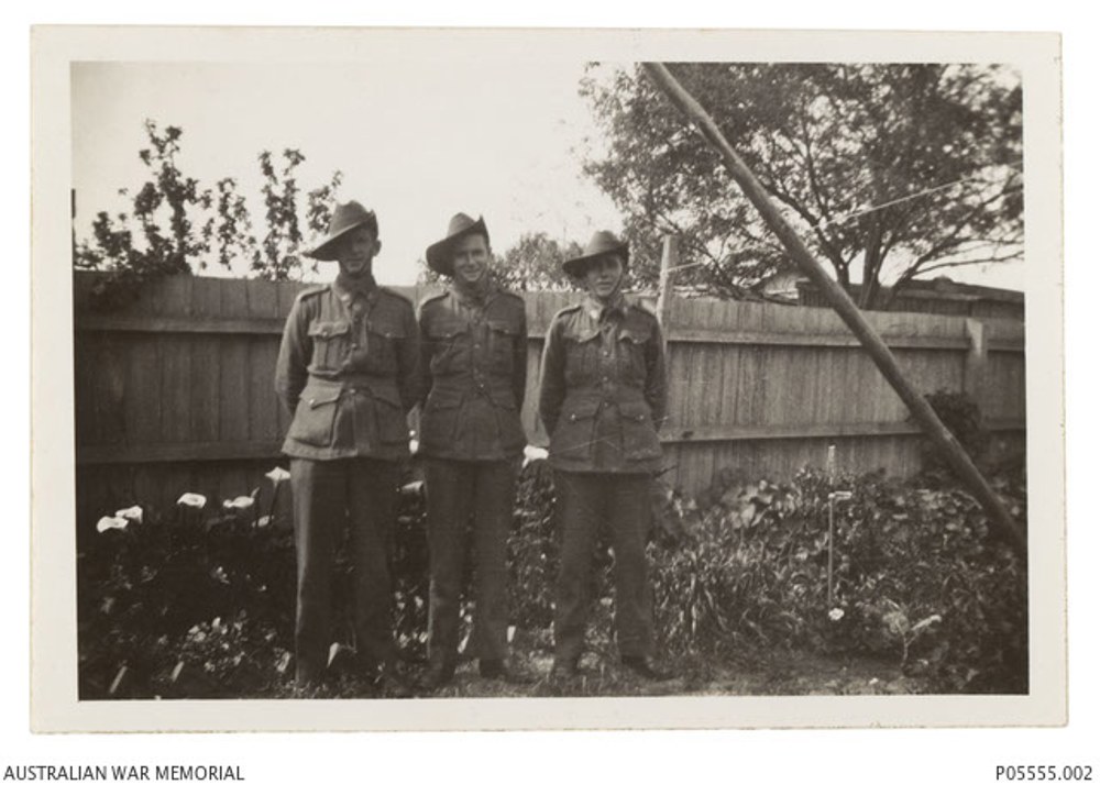 David, Eric and Fred Hutchins in their parents’ garden. The trio are wearing WW2 era Australlian Infantry uniforms.