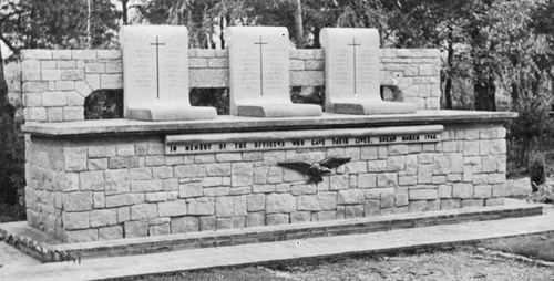 A black and white photo of a war memorial