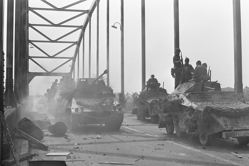 Armoured Vehicles crossing a road bridge during the filming of A Bridge Too Far.