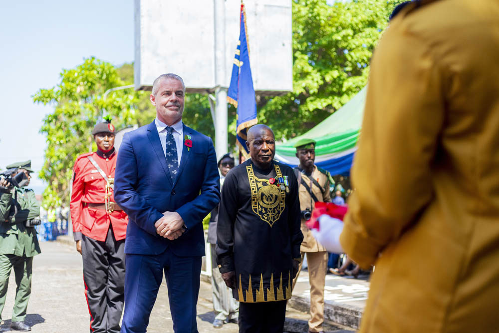 Two men at a commemoration ceremony in Sierra Leone.