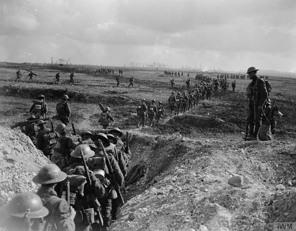 Canadian troops march through a communications trench on their way to the front during the Battle of Canal du Nord.
