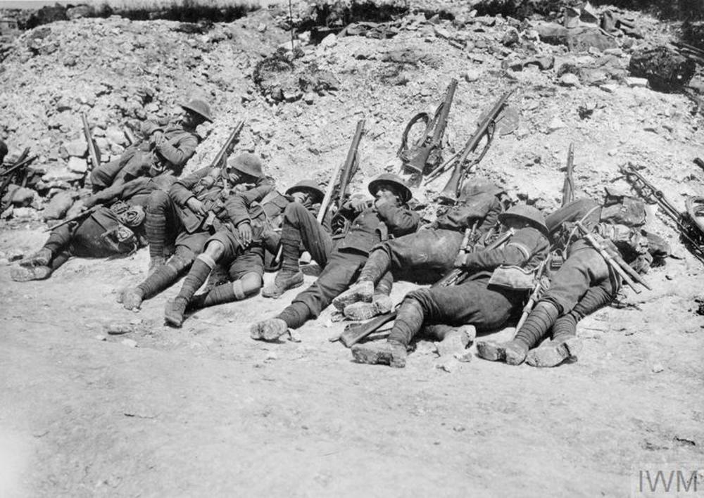 British soldiers lying against some rubble as they prepare to go over the top at Beaumont Hamel, 1 July 1916.