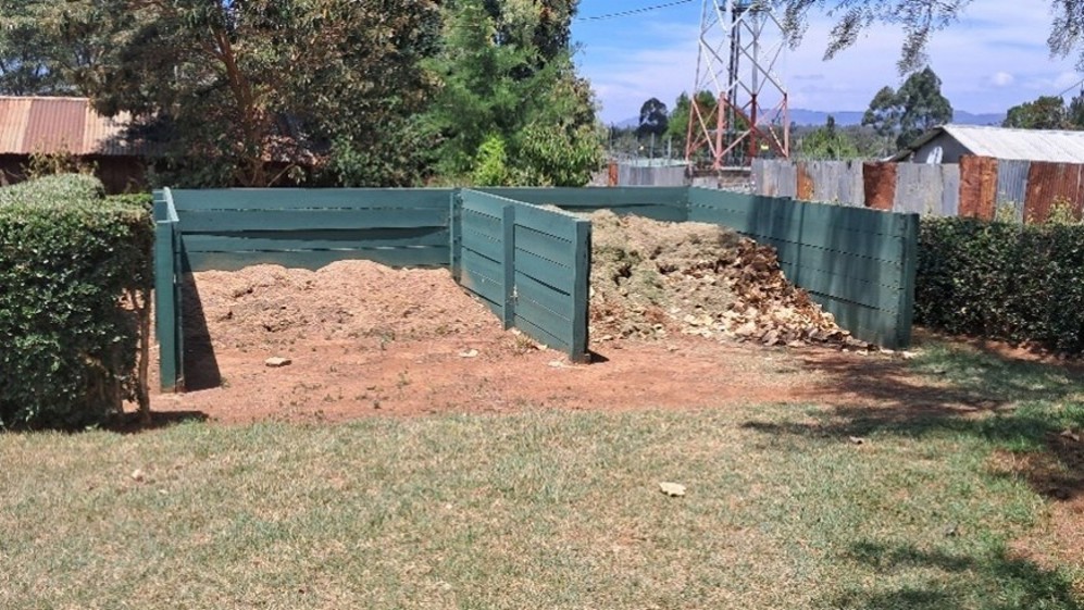 Woodshed and compost heaps at Nayuki War Cemetery, Kenya.