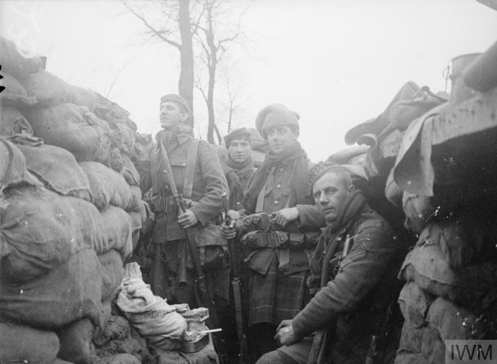 Scottish soldiers occupying a section of sandbag-pined trench near Ypres circa April 1915