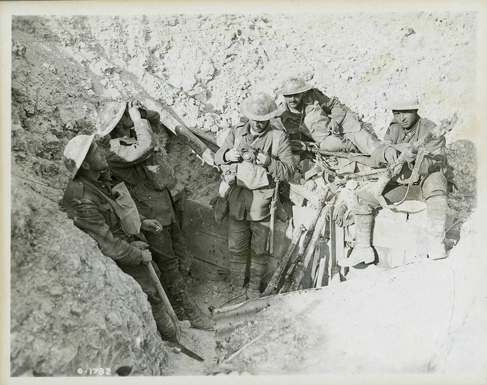 Canadian servicemen resting in a captured German trench during the Battle of Hill 70.