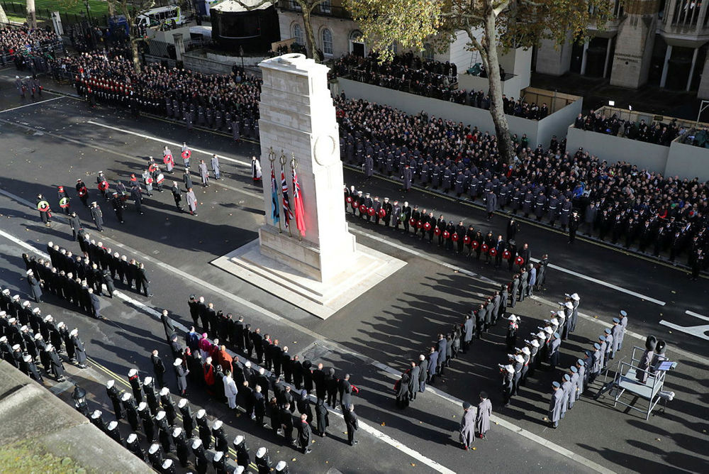 Soldiers and service personnel standing in parade formation around the Cenotaph, London, during Remembrance Day ceremonies.