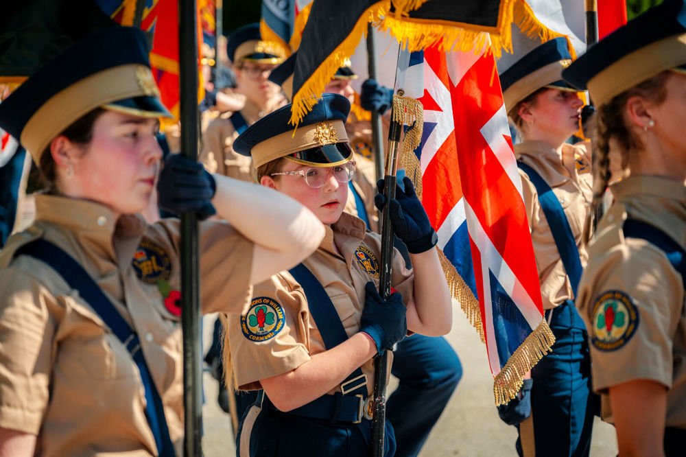 French military cadets holding British banners and standards at the Somme 109th anniversary ceremonies.