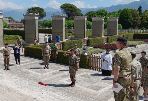 Soldiers stand to attention at the ceremony