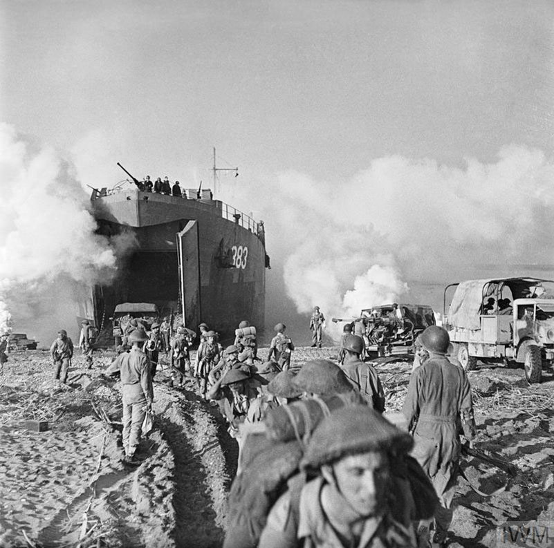 British troops coming out of a troop transport on the beaches of Sicily