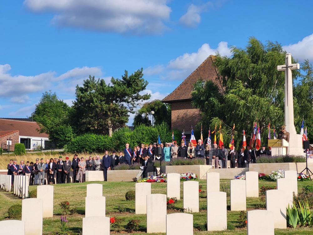 A crowd gathereed for a rededication service at Fromelles Fromelles (Pheasant Wood) Military Cemetery.