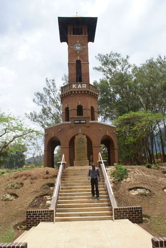 Man walks down the steps in from of the King's African Rifle Memorial, Zomba