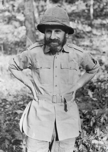 Brigadier Orde Wingate. He is wearing jungle fatigues, incuding a pith helmet and shorts, and sports a great big bushy beard.