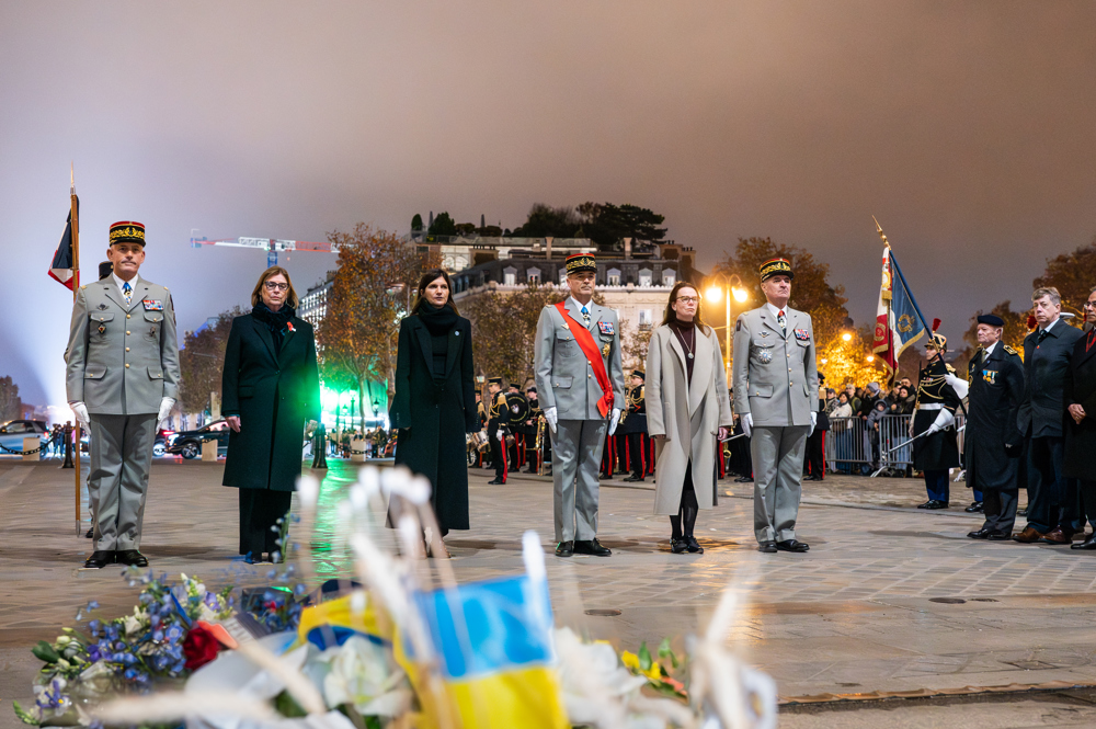 Military Officersand politicians at the Arc de Triomphe for a remembrance ceremony.