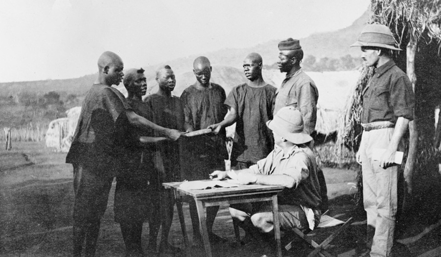 IWM, Q57990 - Gun carriers swearing in on the Koran, Tanzania.