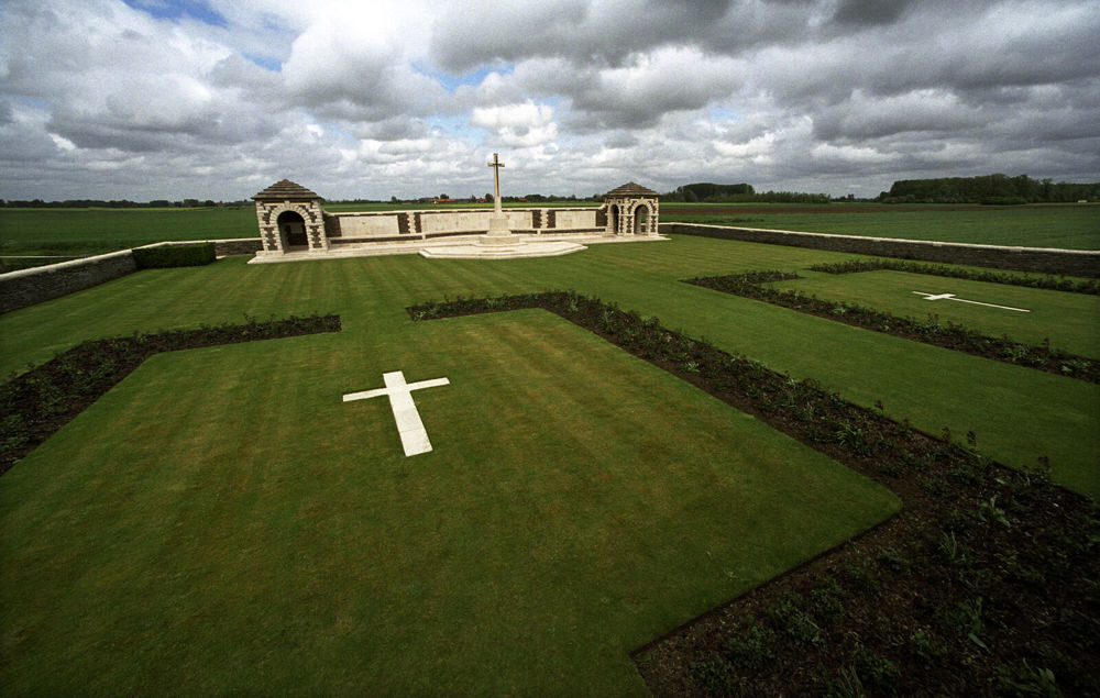 Aerial view of V.C. Corner Cemetery with concrete grave markers visible on each of the two burial plot
