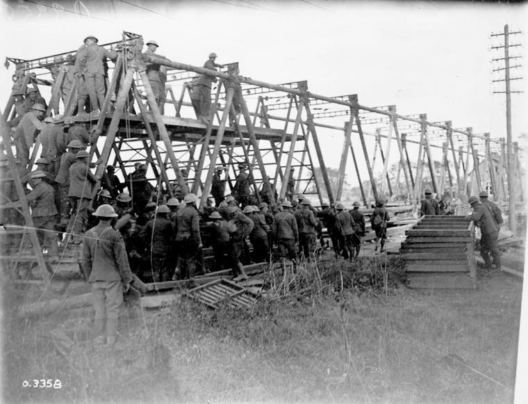 Canadian engineers building a wood-timbered bridge across Canal du Nord during the Hundred Days Offensive.
