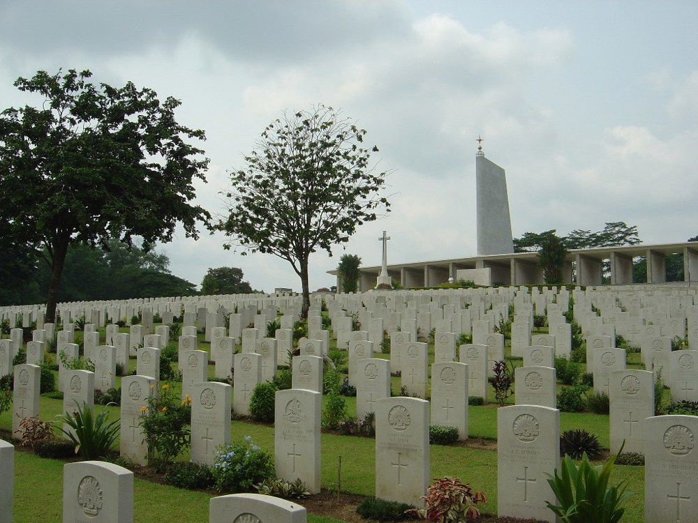 Kranji war Cemetery with Singapore Memorial visible in the background.