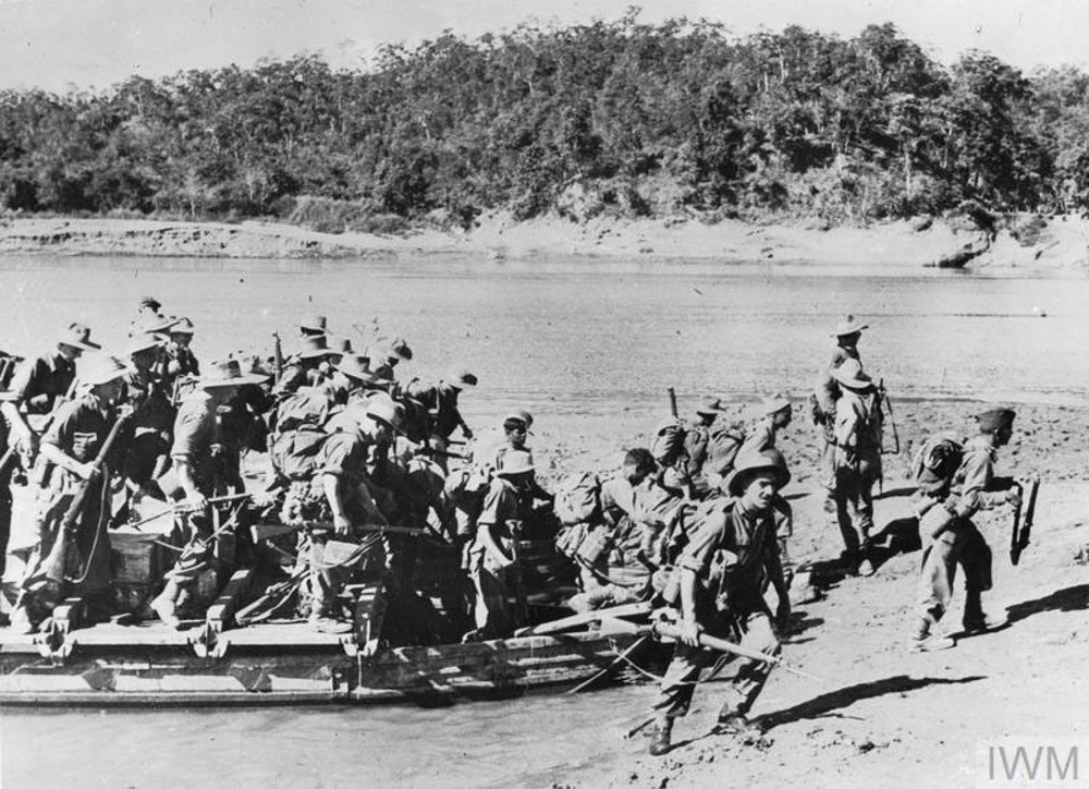 British Second World War troops exit landing craft on the banks of the Chindwin River, Burma, circa January 1945