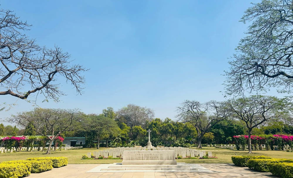 Cross of sacrifice, stone of remembrance, and central plaza at Delhi War Cemetery
