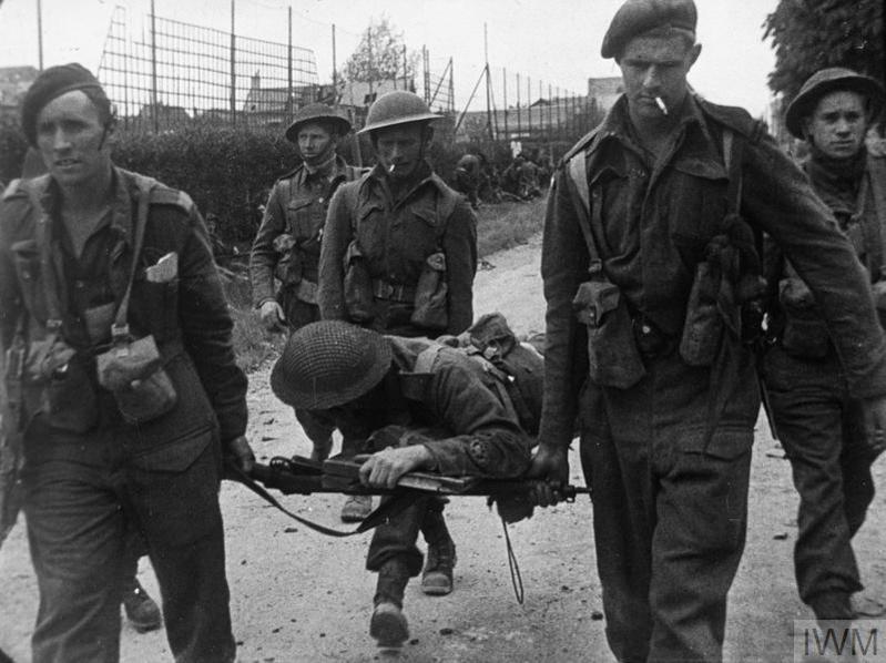 Commandos carrying a wounded comrade on an improvised stretcher in Normandy on June 6 1944.