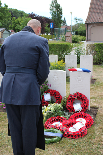 Reverend Klos pays his respects at the graveside