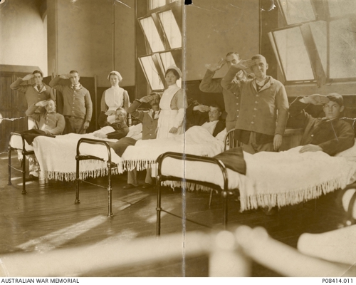 Informal portrait of nine wounded soldiers and two nurses