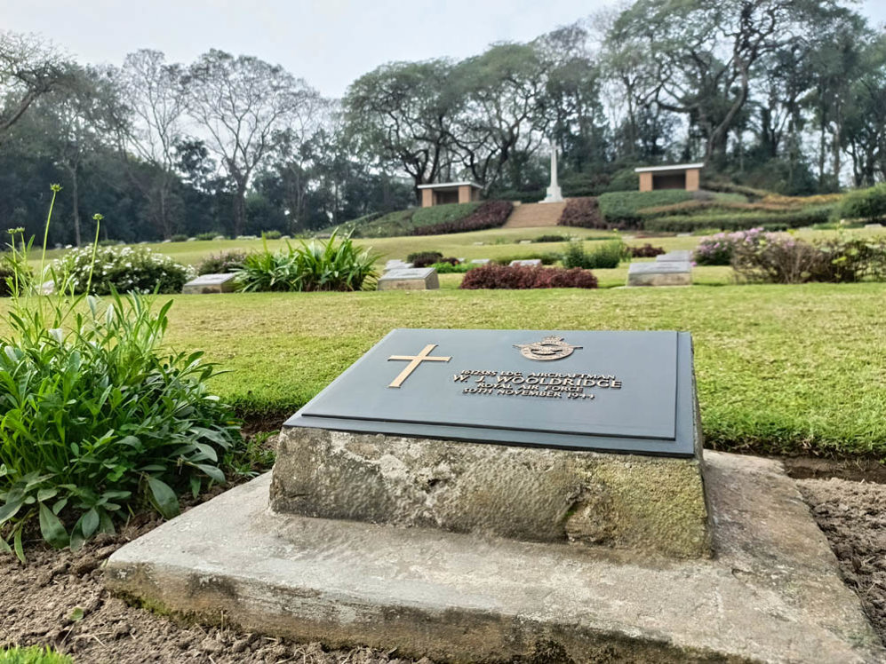 Close up of a bronze plaque grave marker at Maynamati War Cemetery