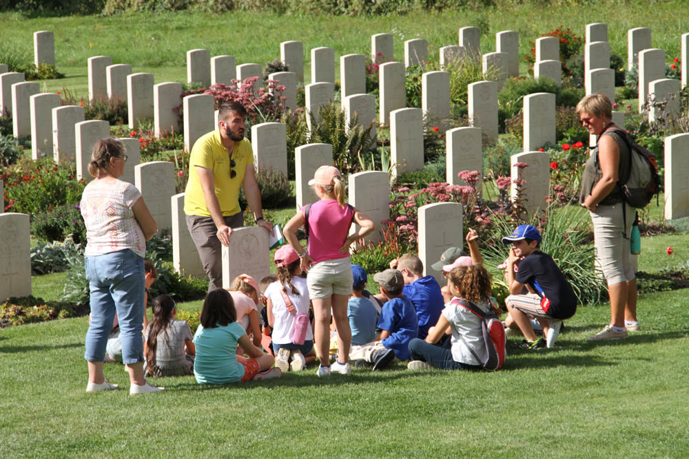 CWGF guide talking children and their minders in a CWGC cemetery.